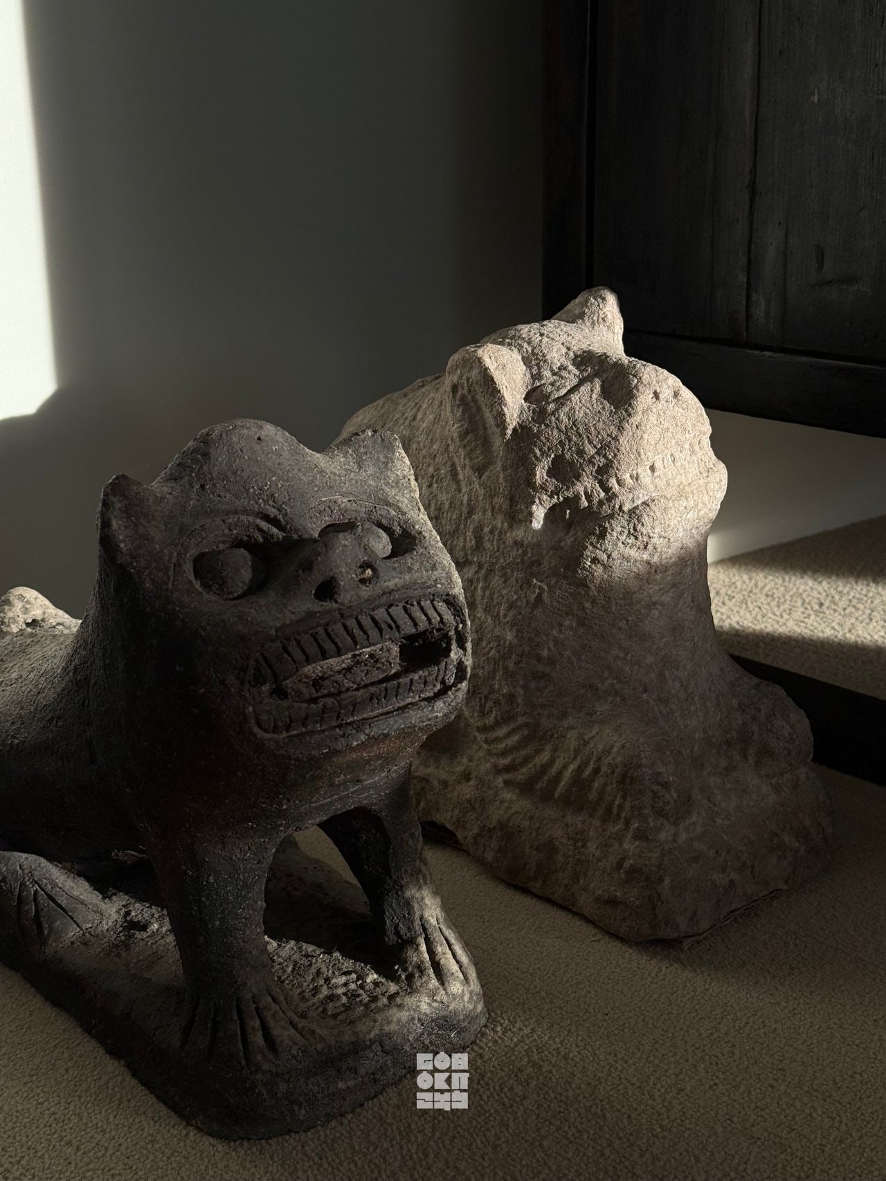 A stone figure detail in the GOBOKII atelier